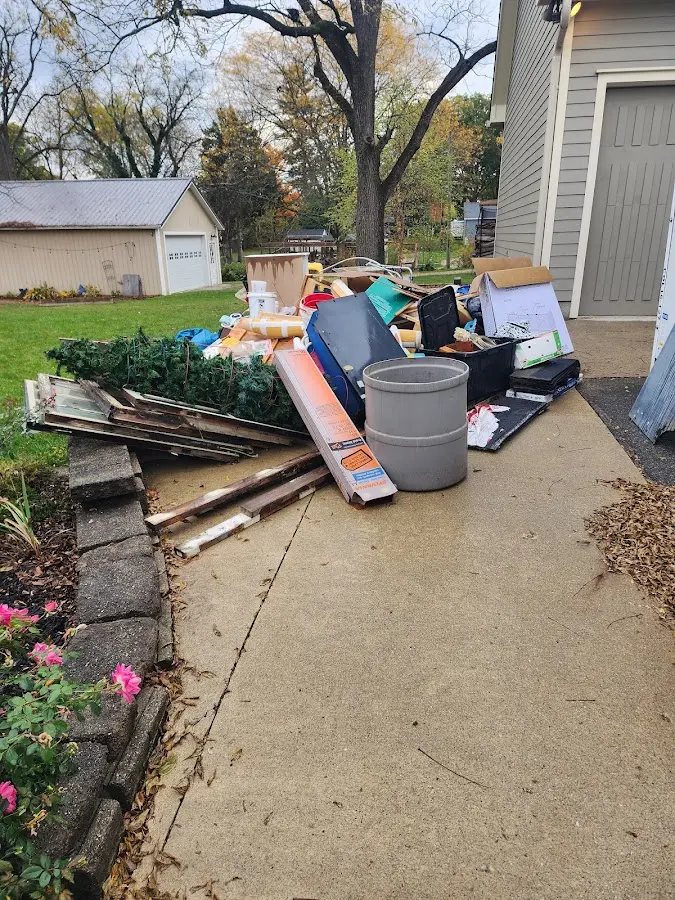 Dumpster being loaded with debris for Roofing Dumpster Rental in Black Forest
